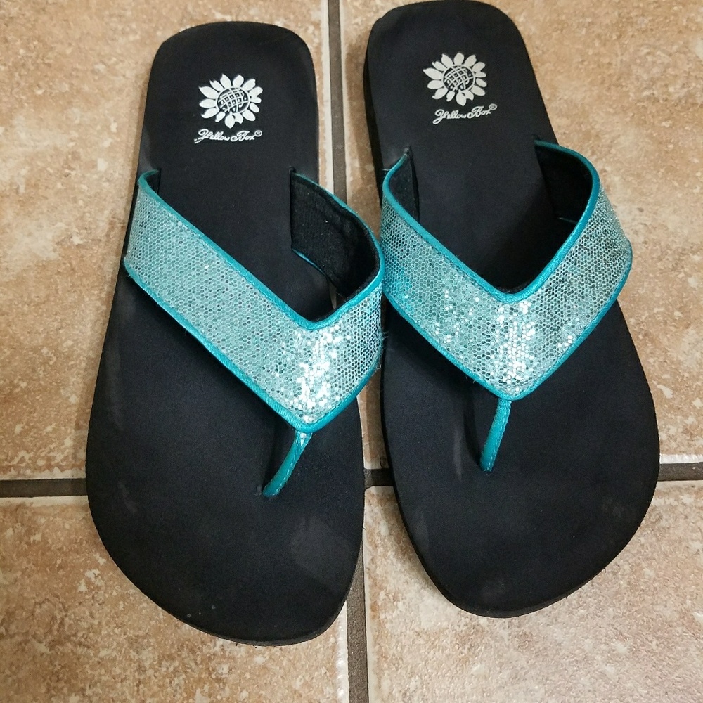Yellow box flip flops
